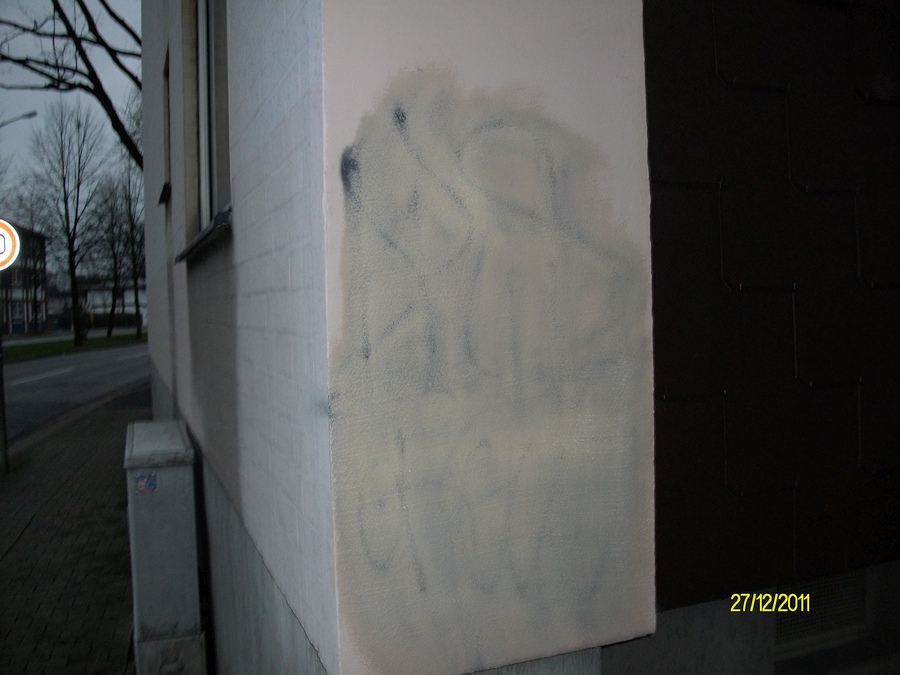 Graffitientfernung gestrichene Wand